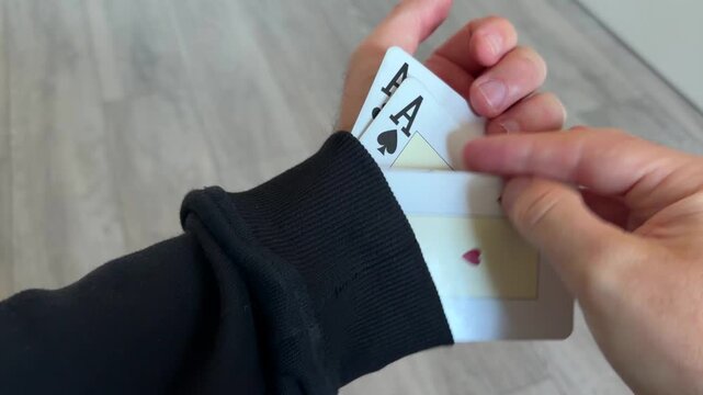 Four Aces Hidden in Sleeve Card Cheating and Poker Scam Concept