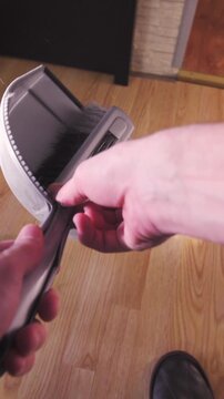 Person POV cleaning up cat toilet sand outside the box