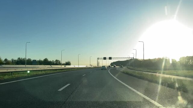 Amsterdam Netherlands highway, Sunlit highway driving toward an open junction
