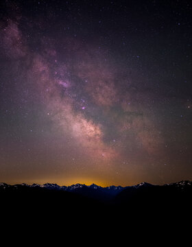 View of the Milky Way galaxy above the silhouette of the Olympic Mountains at Hurricane Ridge, Clallam County, Washington, United States.