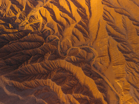 Aerial view of the intricate erosion patterns and winding paths in the Ak Say Canyon and Valley of Forgotten Rivers, Ak Say, Issyk-Kul Region, Kyrgyzstan.