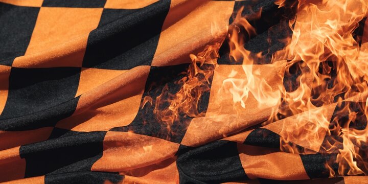 Burning checkered racing flag with flames, motorsport competition background and extreme speed concept