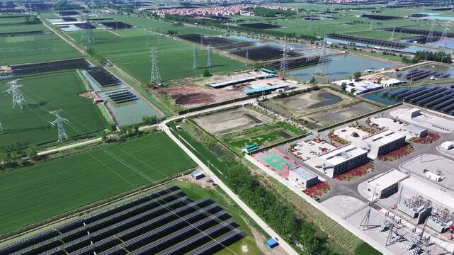 Aerial view of photovoltaic power station coexisting with farmland and wetlands