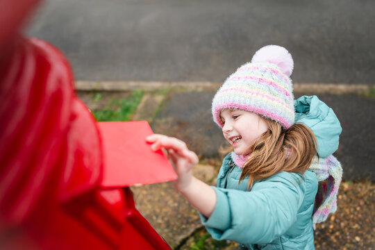 Girl mailing her Christmas wish list, winter holidays