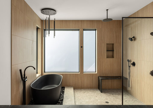 Luxurious bathroom with freestanding soaking tub and walk in shower