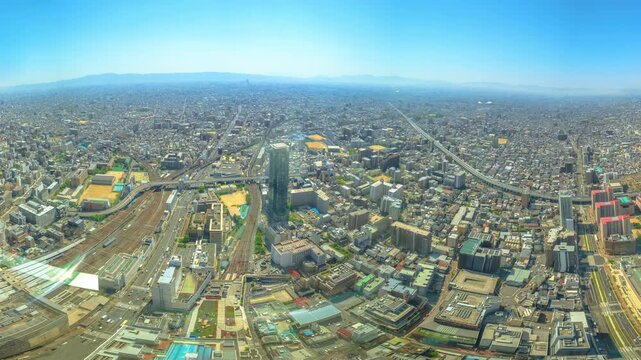 Panorama background of Osaka skyline from observation deck of Osaka's Abeno Harukas, the tallest skyscraper in Japan. Aerial view of Kintetsu Osaka Abenobashi Station and JR Tennoji Station.Copy space