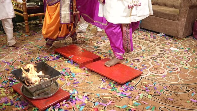Slow-motion close-up of a sacred havan fire and wedding couple performing traditional Hindu marriage rituals, capturing devotion, blessings, and the spiritual essence of the ceremony.