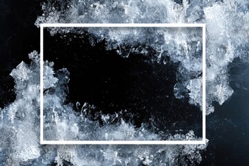 Obraz premium A dark rectangular frame surrounded by icy, textured fragments against a dark background