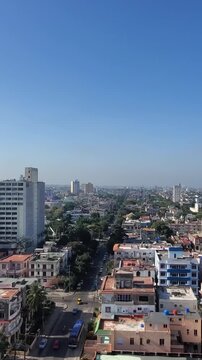 Aerial view of Vedado district showing urban architecture, streets, and buildings under a clear blue sky in Havana, Havana, Cuba.