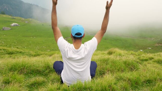 Man Meditating in Misty Himalayan Meadow During Rudranath Temple Trek, Uttarakhand, India