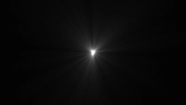 Bright white lens flare effect with radiating light beams on a solid black background for cinematic lighting and visual overlays