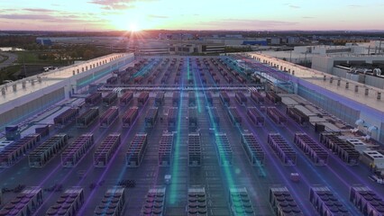 Aerial of AI data center rooftop at sunset with animated 3D purple teal network lines overlay, glowing data flow graphic visualization © TechAnimationStock