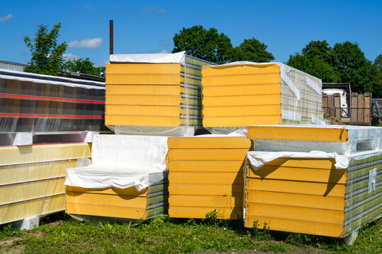 Insulated Sandwich Facade Panels Stored at Construction Site for Modern Building Envelope Systems