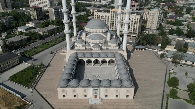 Aerial view of the Imam Sarakhsi Central Mosque featuring its large dome, tall minarets, and courtyard in Bishkek, Bishkek City, Kyrgyzstan.