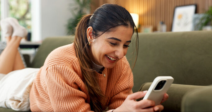 Happy, relax and woman on sofa with phone, online conversation and message notification on weekend. Home, smile and person typing on cellphone for internet, website and social media in living room