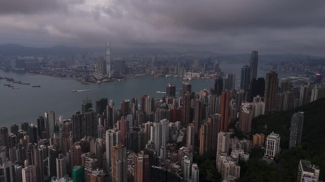 Fly backwards, view of Hong Kong on a cloudy, rainy day