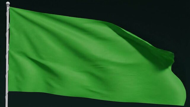A vibrant green flag waving against a dark background