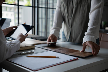 Fototapeta premium Interior Designer Presenting Furniture Options to Client