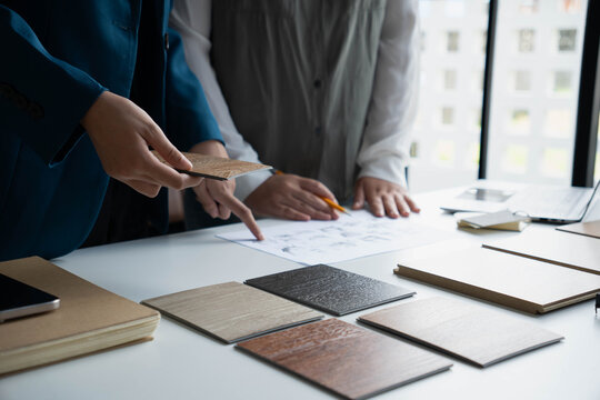 Interior Designer Consulting with Client on Material Selection
