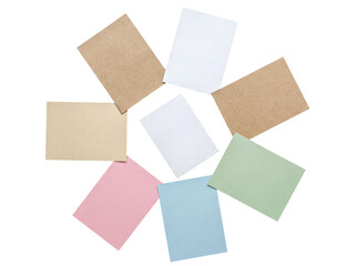 Fototapeta premium Variety of blank pastel and natural tone paper sheets forming a decorative circle, perfect for custom content.