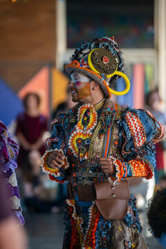 Rio de Janeiro, Brazil - 20 June 2026: View of a performer in an elaborate and colorful Festa Junina costume featuring intricate patterns and a decorative hat during a traditional celebration.