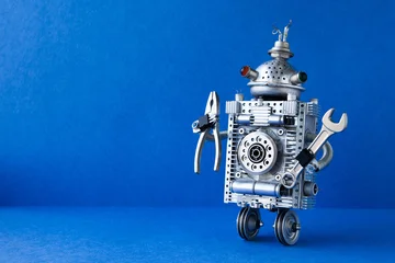 Robot repairman on wheels with pliers and adjustable wrench, blue backdrop text placeholder. Maintenance service flyer, equipment repair leaflet, workshop invitation card © besjunior
