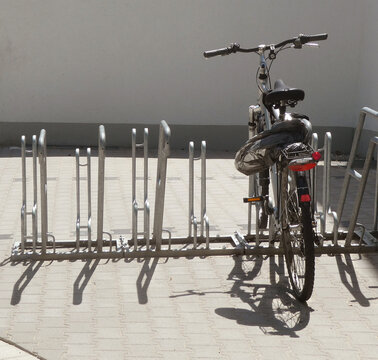 Bike racks on the sidewalk to park your bicycle