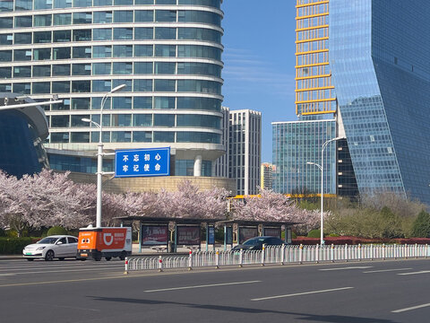 Qingdao, Shandong, China - May 9, 2026: Drone delivery vehicle from Chinese brand DiDi driving along a road among regular traffic, wide shot.