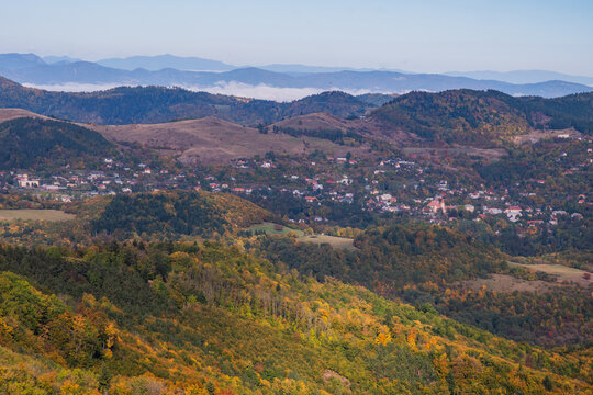 Aerial view of the forested hills and autumn landscape surrounding the village of Ilija near Sitno mountain in Ilija, Banska Bystrica Regio, Slovakia.