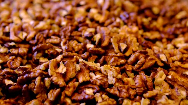 walnuts peeled at the market. Pile of peeled walnuts ready for sale at a popular market.
