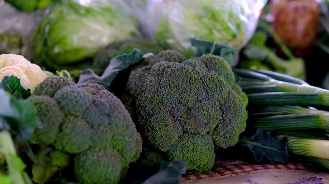 broccoli at market. Fresh green broccoli in rustic wooden box on dark background.