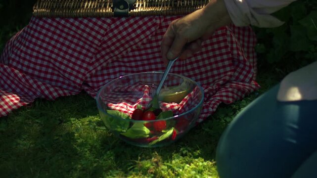 Preparing salad fresh vegatables on vintage picnic basket