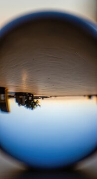 Creative Lens Ball Reflection of a Scenic Landscape at Sunset.