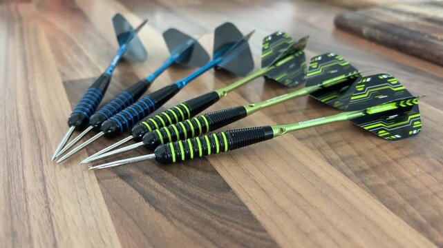 Close Up of Darts Lying on Table Before Indoor Game or Practice