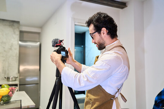Content creator filming cooking video for social media