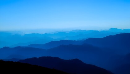 Naklejka premium Mountain range landscape with blue sky and hills in the distance