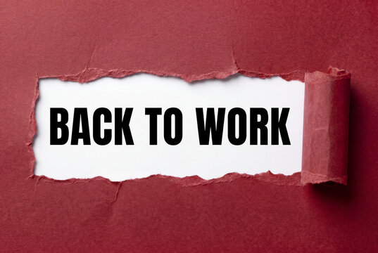 Back to work message revealed through torn red paper, workplace return announcement and business reopening.