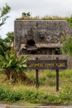 View of the historic Japanese Power Plant ruins at North Field Base, featuring weathered concrete walls with battle damage in Northern Tinian, Tinian, Northern Mariana Islands.