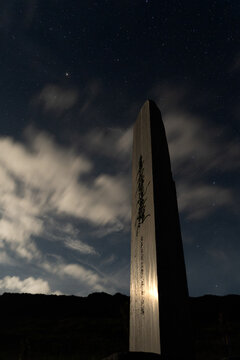 View of the Japanese Citizens for memorializing Tokyo Raids memorial standing tall under a starry night sky in Carolinas, Tinian, Northern Mariana Islands.