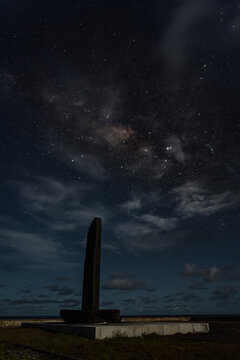 View of the Japanese Citizens for memorializing Tokyo Raids memorial under a starry night sky with the Milky Way visible, Carolinas, Tinian, Northern Mariana Islands.