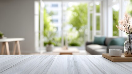 Fototapeta premium Copy space on a white table with a blurred modern living room in the background.