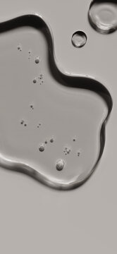 Transparent liquid gel texture top view on neutral background. Cosmetic cleansing concept excellent for men skincare advertising or detox face mask.