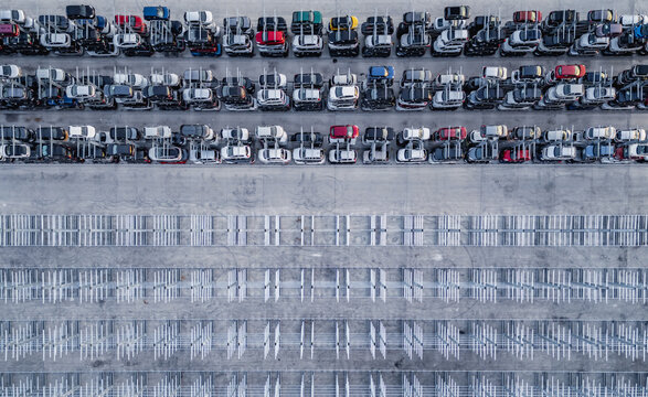 Livron-sur-Drome, France - 20 June 2026: Aerial view of a vehicle salvage yard with rows of damaged and end-of-life cars stored in metal racks.