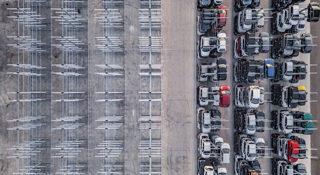 Livron-sur-Drome, France - 20 June 2026: Aerial view of an automated car storage system with rows of vehicles stacked in metal racks at a facility.
