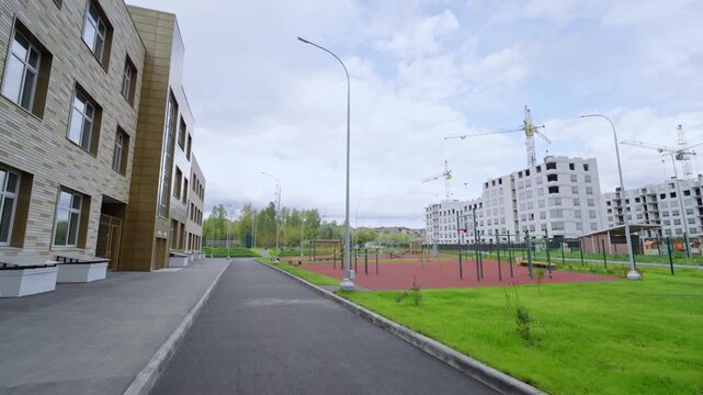 New residential development and bright athletic zone create fresh atmosphere for students. Architecture defines this growing district