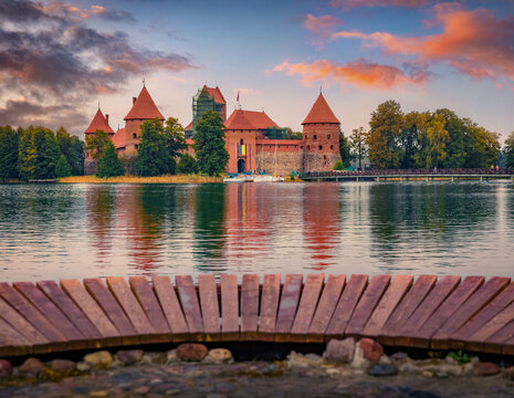 Picturesque autumn sunrise on Trakai Island Castle on Galve lake, Trakai District Municipality, Lithuania, Europe. Amazing morning cityscape of Trakai town. Traveling concept background.