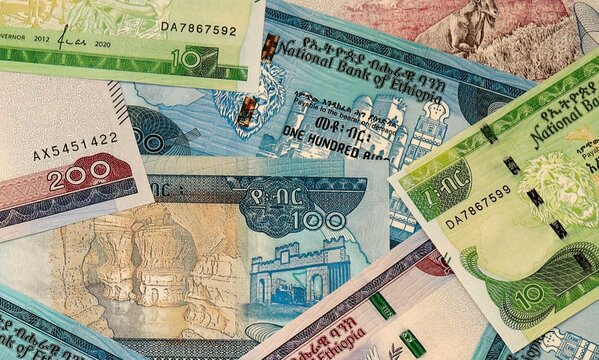 Ethiopian birr money bills in pile on table. Ethiopia ETB currency cash close up