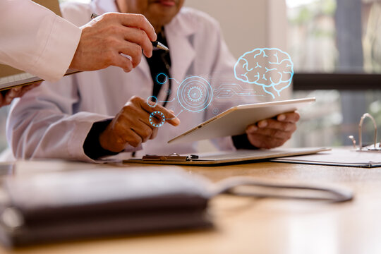 Healthcare professionals using a digital tablet with AI brain interface for medical analysis and patient care. Concept of artificial intelligence, healthcare technology diagnostics