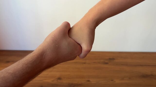 Close-up of two people shaking hands, symbolizing agreement, partnership, trust and successful cooperation. Professional business concept representing teamwork, negotiation and mutual respect.
