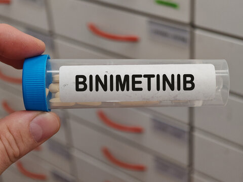 Transparent plastic Box of BINIMETINIB tablets on a hospital pharmacy table used to treat melanoma a MEK inhibitor.